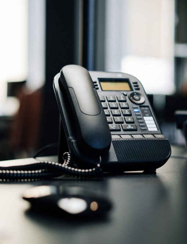 AI receptionist answering phone in office AI receptionist answering phone in office