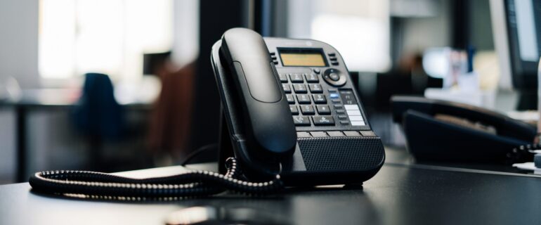 AI receptionist answering phone in office AI receptionist answering phone in office